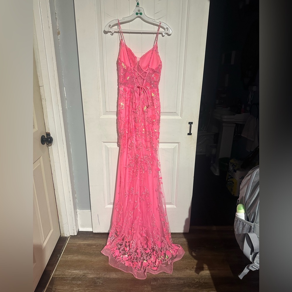Hot pink prom dress with iridescent details.